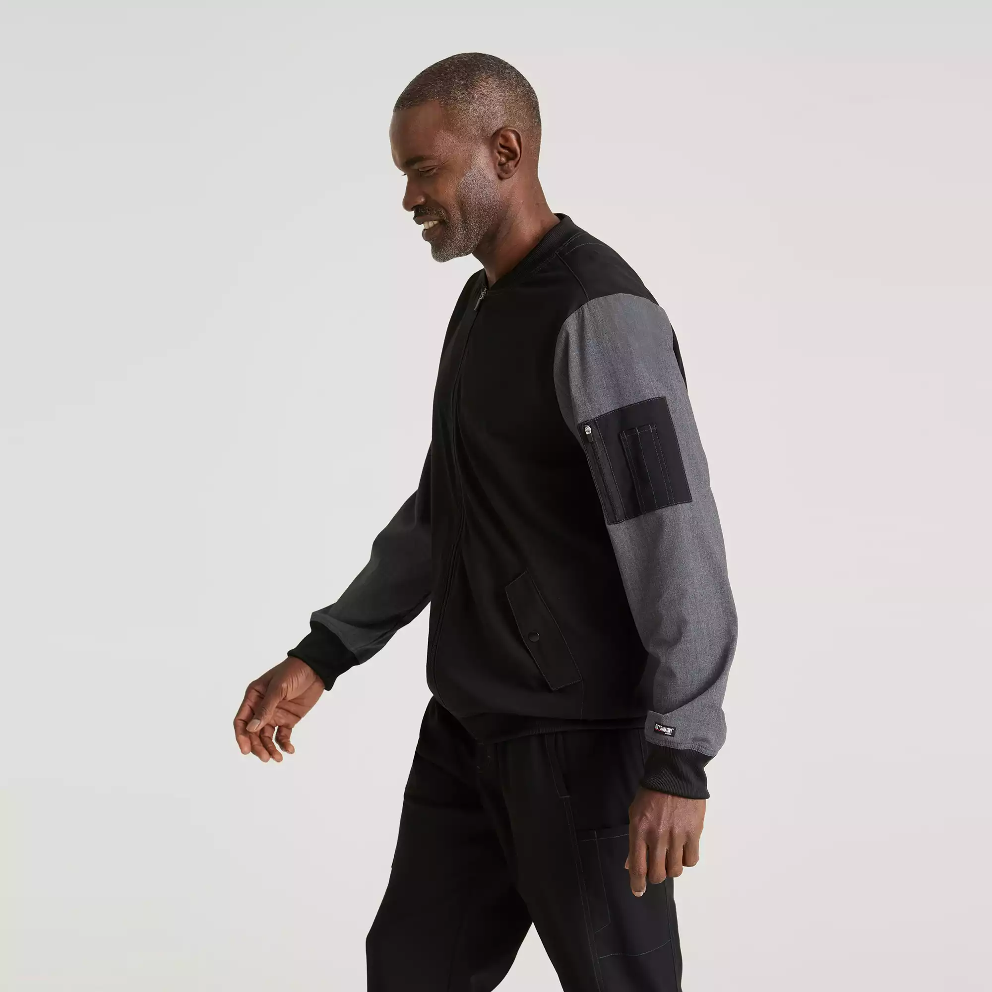 Greys-Anatomy-Spandex-Stretch-Mens-4-Pocket-Two-Toned-Zip-Front-Warm-Up-Jacket-GRSW892-Black-03.webp